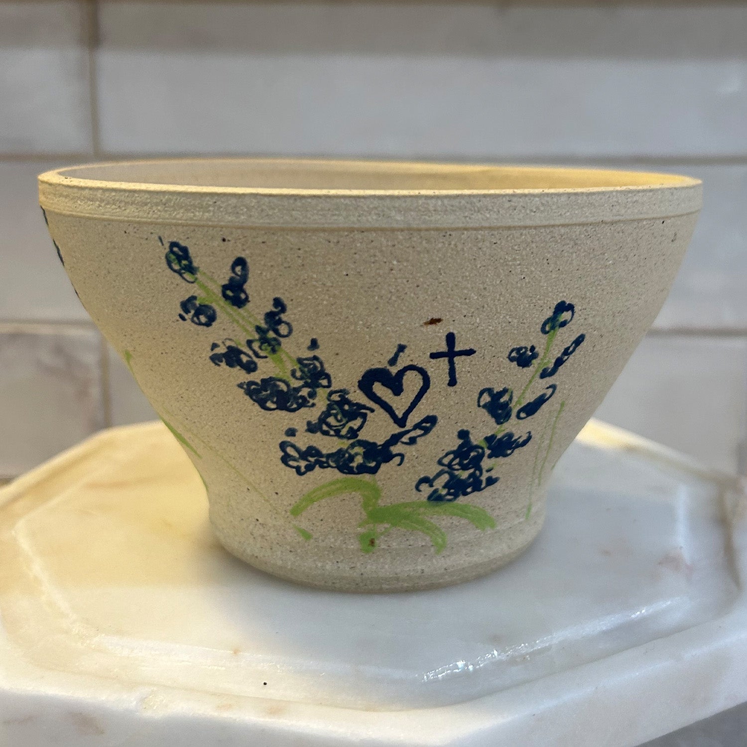 Handcrafted Pottery Bowl with Blue Floral Design